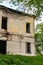 Old abandoned manor house with boarded up windows