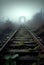 Old abandoned railway tracks leading to a tunnel in the fog. AI Generated