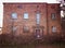 Old abandoned red brick house facade decay abstract