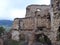 Old abandoned ruin of a castle covered with vegetation