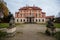 Old abandoned ruined baroque Libechov castle with balcony in sunny day, Romantic chateau was heavily damaged after affected by