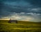 An Old Abandoned School in a Sea of Bright Yellow Canola in Bloom