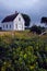 Old abandoned schoolhouse in a rural field