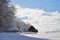 An old abandoned sheepfold covered in snow in the beginning of winter.