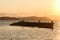 Old abandoned skeleton of a wooden ship half sunken in the sea