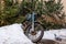 Old, abandoned, snowy motorcycle in the home yard