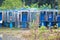 Old abandoned telephone booths in the thickets