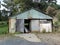 Old abandoned tin and timber shed in Strahan