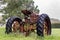 Old abandoned tractor sitting in the rain