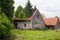 Old abandoned traditional village house. Collapsed roof.