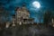 An old abandoned Victorian mansion house with tomb stones in the garden under a moonlit sky at night. 3D rendering