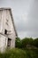 Old, Abandoned, Weathered Barn Door Swings in Stor