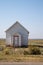 Old, abandoned whitewashed small building, taken in rural Wyoming, near Carter