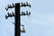 Old abandoned wooden electrical pylon with insulators and wires