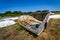 Old abandoned wrecked fishing boat at ship or boat graveyard.