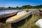 Old abandoned wrecked speed boat at ship or boat graveyard.