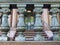 Old academic building detail - Silver painted balustrade with pink marble steps and entrance door visible showing through