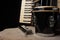 Old accordion, harmonica and bong on rustic wooden surface with black background and Low key lighting, selective focus