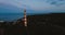 Old active lighthouse. Gloomy sky and cold blue atmosphere. Beach, north misty sea in vintage Scandinavian style