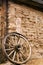 Old Adobe Building and Wooden Wagon Wheel in Tucson Arizona