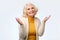 Old adult blonde excited cheerful astonished lady smiling, laughing