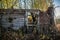 Old aged and damaged wooden house in fall