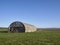 An old Airfield Nissan Hut, now a Farmers Barn at Stracathro Airfield.