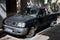 Old all-terrain first generation black Nissan Navara car parked on the street in Soller, Spain