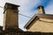 Old alpine village built on top of a mountain. Bell towers,Houses and stone roofs