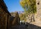 Old alpine village built on top of a mountain. Bell towers,Houses and stone roofs