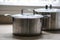 Old aluminum stainless steel cooking pot on kitchen table
