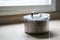 Old aluminum stainless steel cooking pot on kitchen table