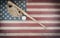 Old American baseball equipment on vintage United States wooden flag setting