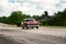 Old american classical car in highway road of Cuba