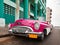Old American retro car (50th years of the last century), an iconic sight in the city, on the Malecon street January 27, 2013 in O