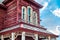 Old american western red house against blue sky