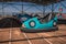 An old amusement ride in an abandoned amusement park. Abandoned carousel and cars. Sunny day.