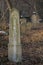 Old ancient abandoned jewish cemetery in the forest in the winter. Aged tombstones or gravestones in the graveyard