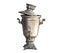 Old ancient chrome samovar contaminated with soot and grease, on a white isolated background