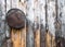 Old ancient grater for vegetables hanging on a wooden wall