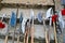 The old ancient medieval cold weapons, axes, olibards, knives, swords with wooden handles lick on the stone steps of the castle