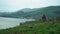 Old ancient Monastery church by Sevan Lake in Armenia. Summertime windy day