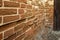 Old ancient red brick wall with cement mortar with egg. A resistant mortar keeps broken bricks