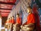 Old ancient stuccoed Buddha images in the attitude of subduing Mara evil spirit in gallery of main chapel of Wat Arun The