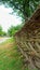 Old ancient Ukrainian wicker by hands fence in the village