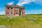 The old Aneroid Consolidated School in Aneroid, Saskatchewan with teeter totters in the foreground