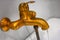 Old antique bath tap working, water flow, made of brass or copper