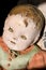 Old antique childs doll with creepy face