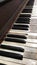 Old antique distressed piano keyboard close up side view