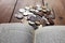 An old antique Indian paise coins. Old Indian vintage coins isolated on wooden background.